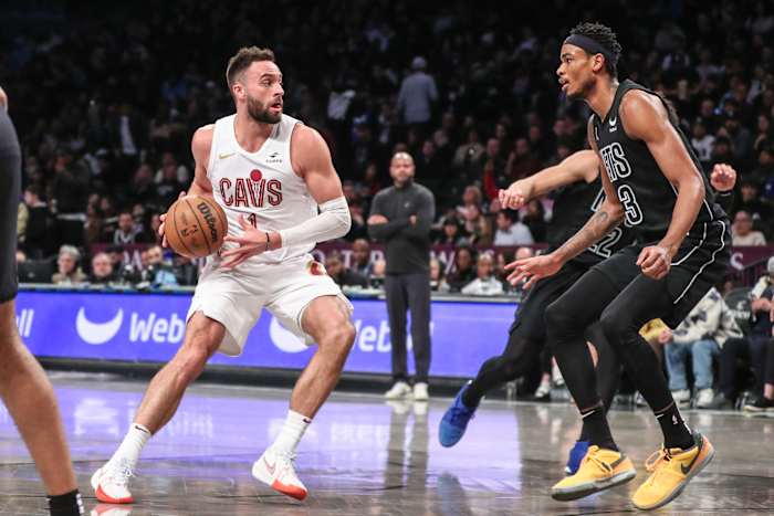 Feb 8, 2024; Brooklyn, New York, USA; Cleveland Cavaliers guard Max Strus (1) looks to drive past Brooklyn Nets center Nic Claxton (33) in the second quarter at Barclays Center. Mandatory Credit: Wendell Cruz-USA TODAY Sports